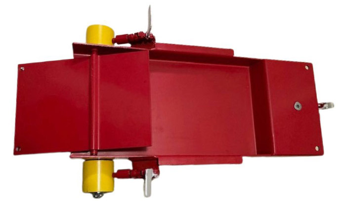 Red metal industrial component with yellow and silver parts.